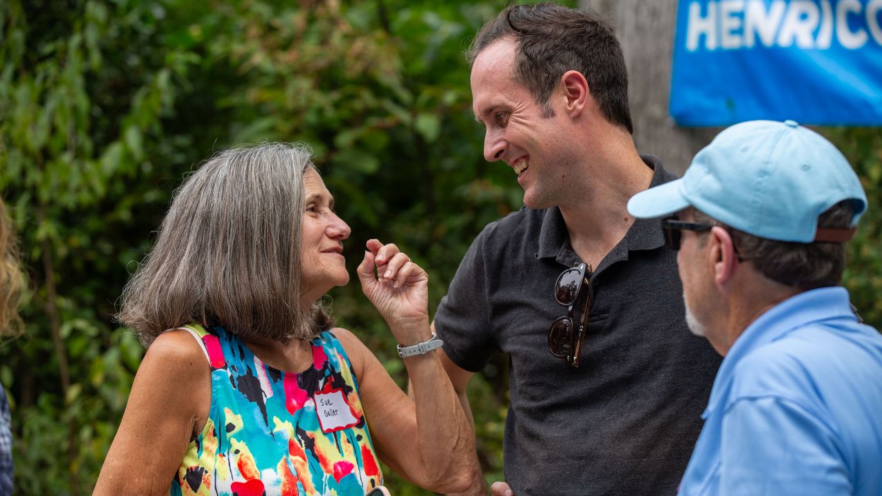 Sue Geller, left, speaks with Democratic state Del. Schuyler VanValkenburg, who's running for Virginia's state Senate District 16, after a rally and canvassing event with Sen. Tim Kaine in Glen Allen, Virginia, on September 9, 2023.
