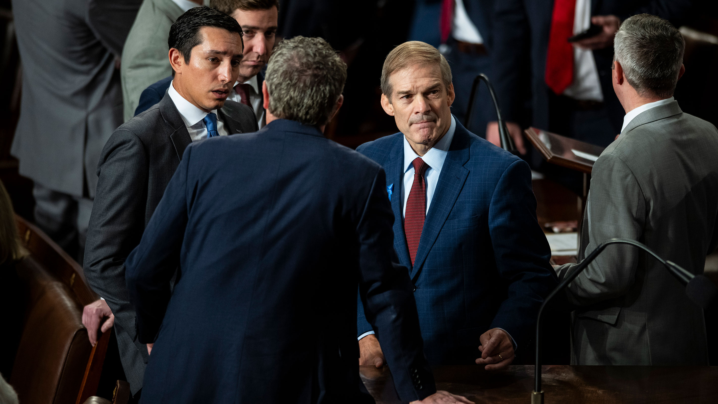 Rep. Jim Jordan speaks with lawmakers and aides before a second round of voting for Speaker of the House begins on Wednesday.