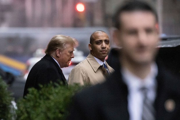 Former President Donald Trump leaves his apartment building, Friday, Jan 26, 2024, in New York. Closing arguments are to begin Friday in the defamation case against Trump a day after the former president left a New York courtroom fuming that he hadn't been given an opportunity to refute E. Jean Carroll's sexual abuse accusations. (AP Photo/Yuki Iwamura)
