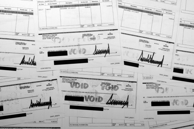 Copies of checks from Donald Trump to attorney Michael Cohen from 2017, shown as exhibits by prosecutors in the hush money trial against former President Donald Trump, are photographed Tuesday, May 7, 2024.