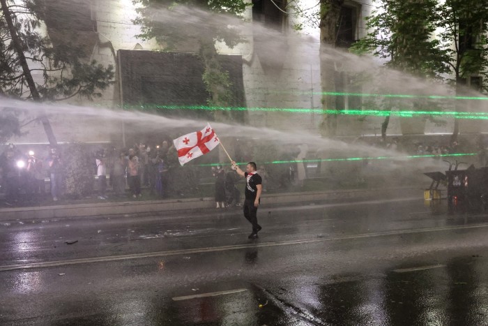 Police use water cannons to disperse protesters