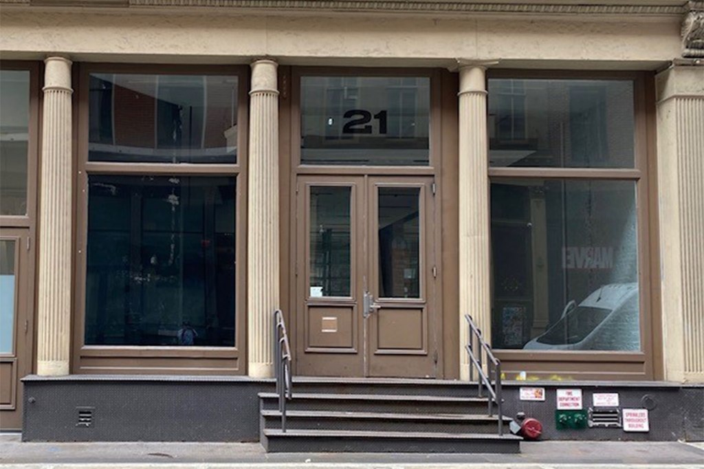 A building with a door and windows at 21 Mercer St. in Soho